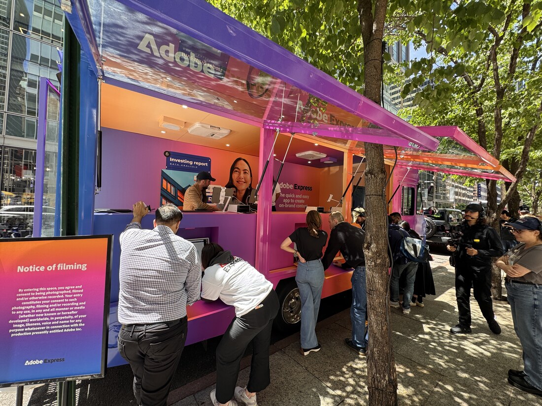 Glass display truck activation with a crowd on a city street